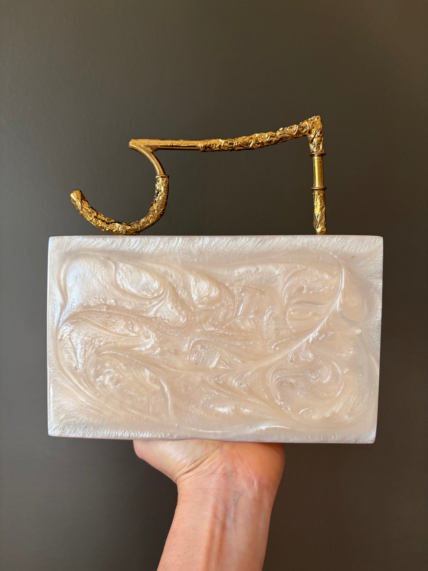 Sculpted Pearl-White Rectangle Clutch With Textured Gold Handle