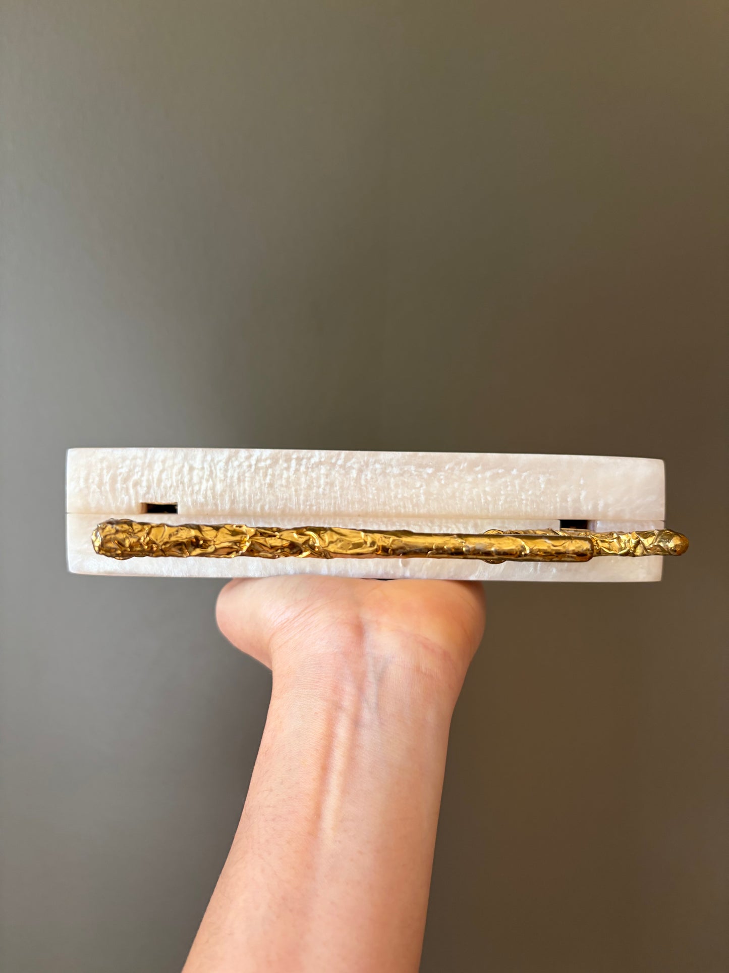 Sculpted Pearl-White Rectangle Clutch With Textured Gold Handle