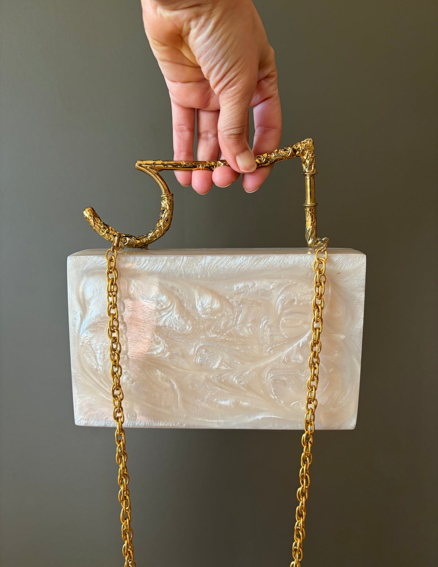 Sculpted Pearl-White Rectangle Clutch With Textured Gold Handle