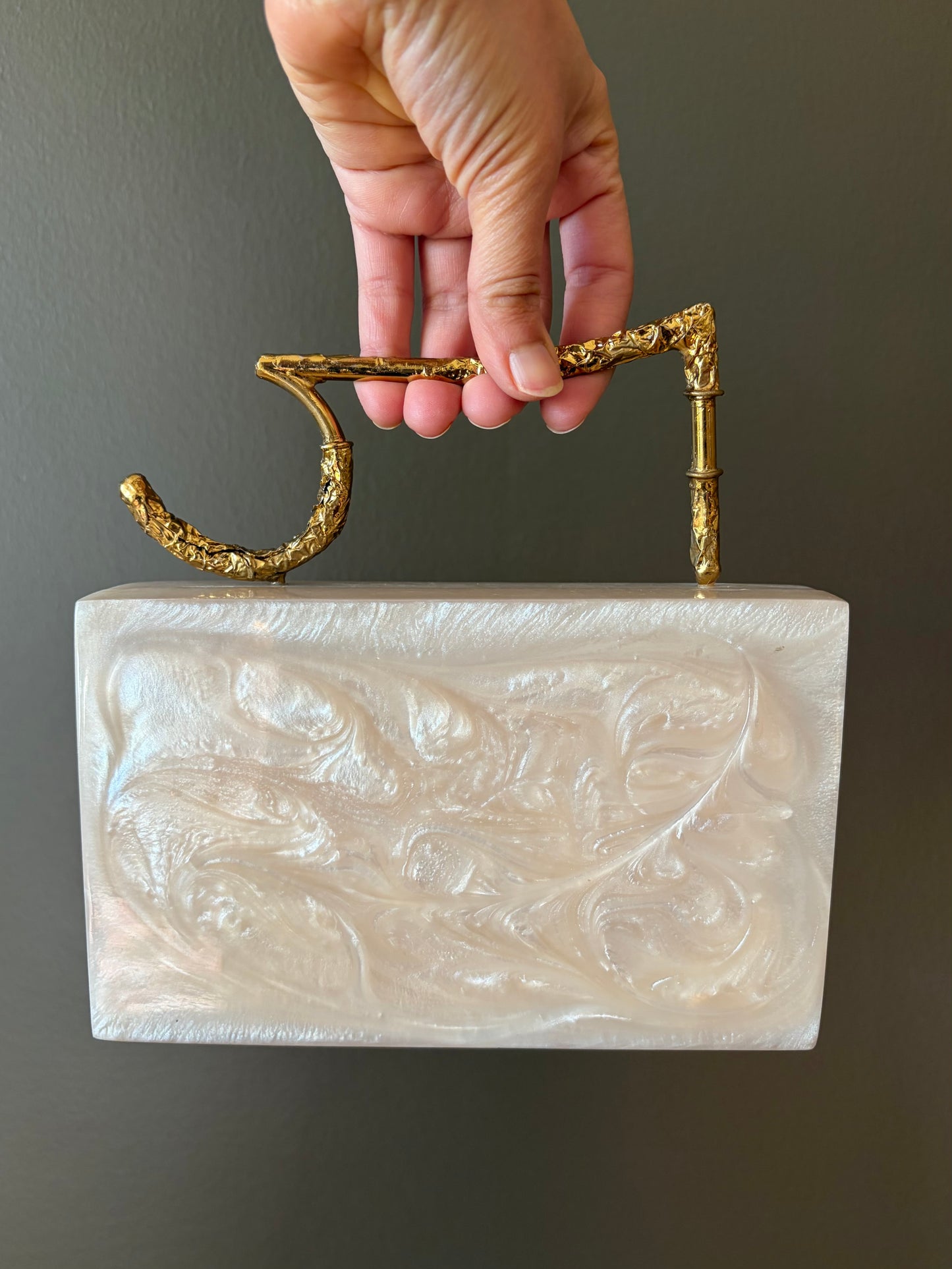 Sculpted Pearl-White Rectangle Clutch With Textured Gold Handle