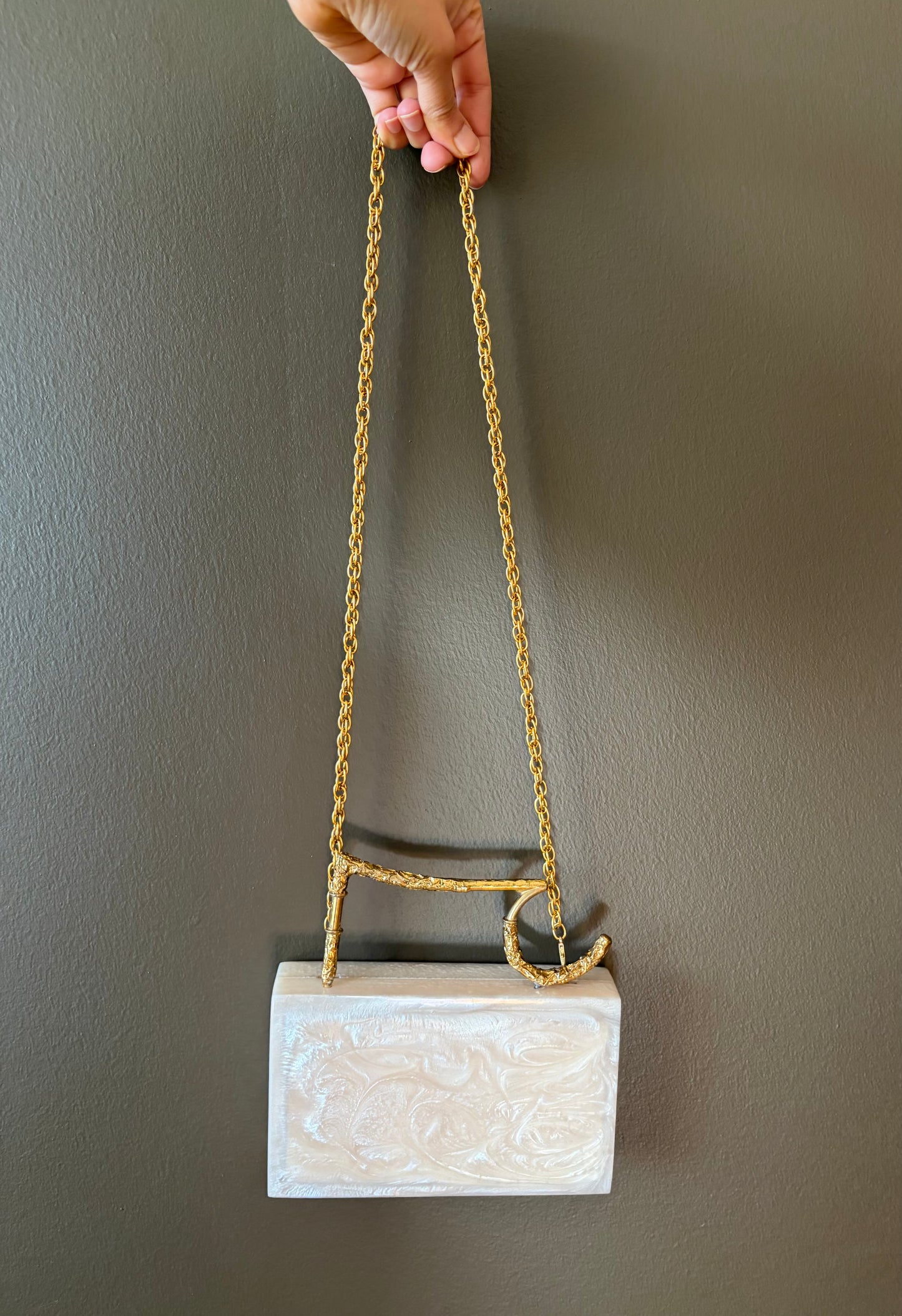 Sculpted Pearl-White Rectangle Clutch With Textured Gold Handle